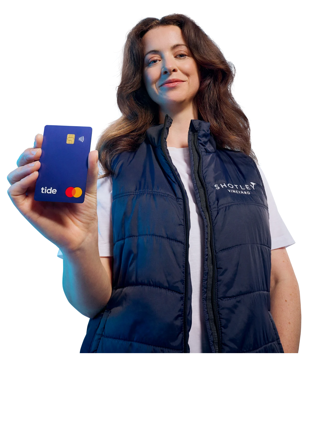 A Tide business customer holding a blue Tide card